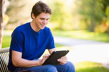 people on park benches - Homme assis sur un banc de parc en utilisant iPad Photographie de stock - Rights-Managed, Code: 700-03799531