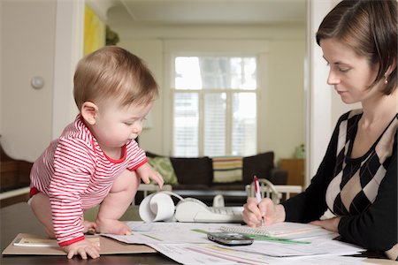 paper work - Woman Doing Paperwork with Baby on Table Stock Photo - Rights-Managed, Code: 700-03799541