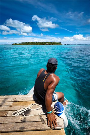 Man on Boat to Fafa Island Resort, Nuku'alofa, Tongatapu, Kingdom of Tonga Foto de stock - Con derechos protegidos, Código: 700-03814141