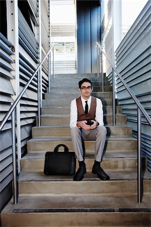 professional man glasses - Businessman Sitting on Stairs Stock Photo - Rights-Managed, Code: 700-03814374