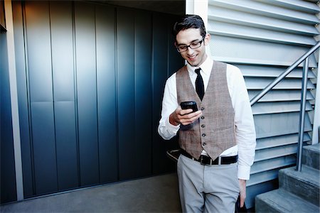 Businessman with Cell Phone Stock Photo - Rights-Managed, Code: 700-03814379