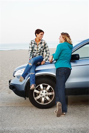 female friends at beach - Young Man and Woman Having Conversation Stock Photo - Rights-Managed, Code: 700-03814394