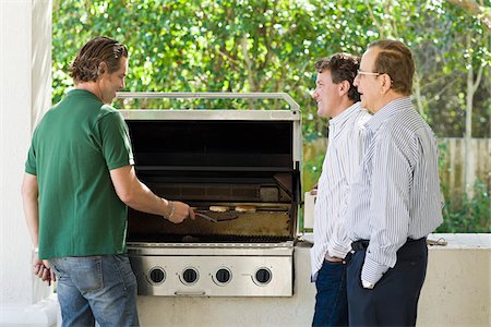 smiling senior people talking family - Men Barbequing Stock Photo - Rights-Managed, Code: 700-03814696