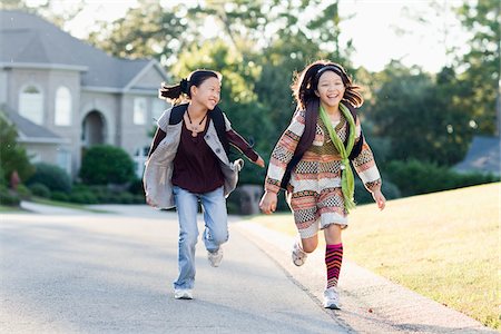 Two Girls Running to School Foto de stock - Con derechos protegidos, Código: 700-03814712