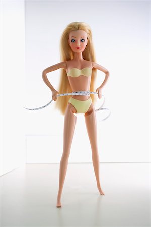 diät - Doll Measuring Waist with Measuring Tape Stock Photo - Rights-Managed, Code: 700-03815232