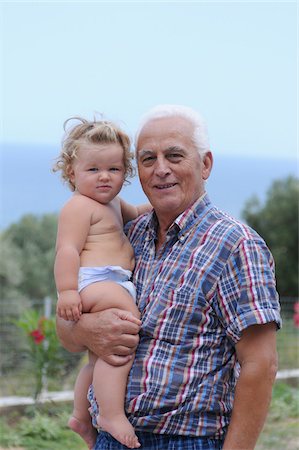 diaper girl not father - Grandfather Holding Granddaughter Stock Photo - Rights-Managed, Code: 700-03836234