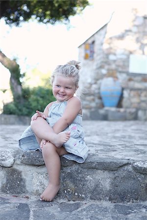 european courtyard - Little Girl Sitting with Legs Crossed Stock Photo - Rights-Managed, Code: 700-03836246