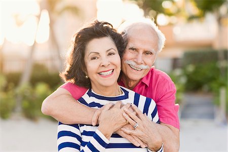 senior couple eye contact head and shoulders not indoors - Couple sur la plage Photographie de stock - Rights-Managed, Code: 700-03848848