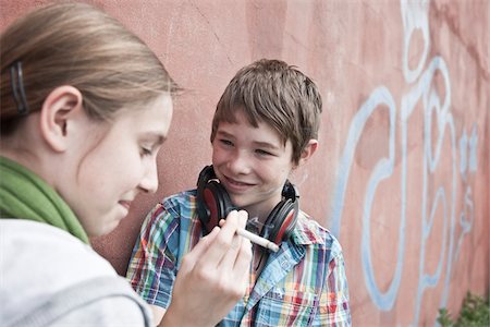 simsearch:6110-06702680,k - Young Teens Smoking Cigarette Foto de stock - Con derechos protegidos, Código: 700-03849062