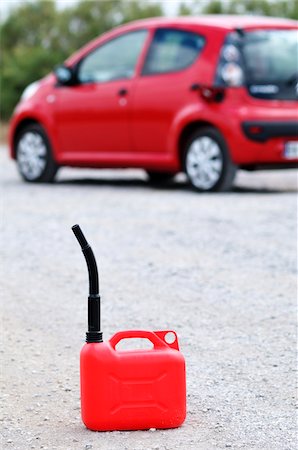 petrol & gas photos - Gas Can on Road in front of Car Stock Photo - Rights-Managed, Code: 700-03849539
