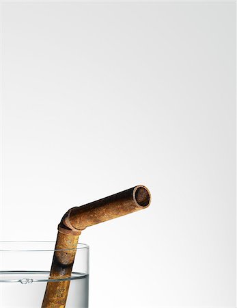 Glass of Water with Rusty Pipe for Drinking Straw Foto de stock - Con derechos protegidos, Código: 700-03849768