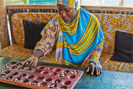 Femme jouant Bao, Zanzibar, Tanzanie, Afrique Photographie de stock - Rights-Managed, Code: 700-03865396