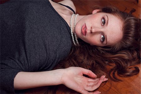 pearl necklace - Woman Lying on Floor Stock Photo - Rights-Managed, Code: 700-03891029