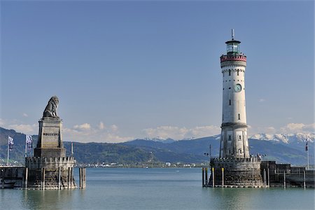 reloj de la torre - Harbor Entrance with Lighthouse and Lion Statue, Lindau, Bavaria, Germany Foto de stock - Con derechos protegidos, Código: 700-03891091