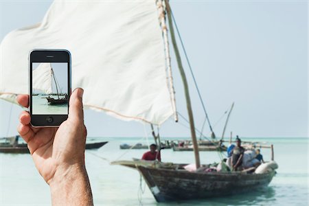 dhow boat - Man Taking Picture with Smartphone Stock Photo - Rights-Managed, Code: 700-03907390