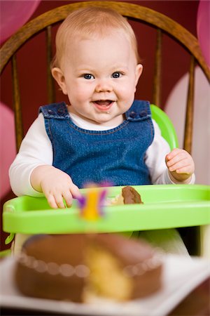 people eating baked goods - Baby Girl Eating Cake in High Chair Stock Photo - Rights-Managed, Code: 700-03908026