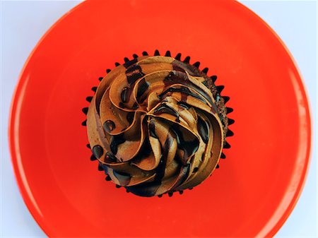 Overhead Of Single Chocolate Cupcake With Icing Stock Photo - Rights-Managed, Code: 824-07310349