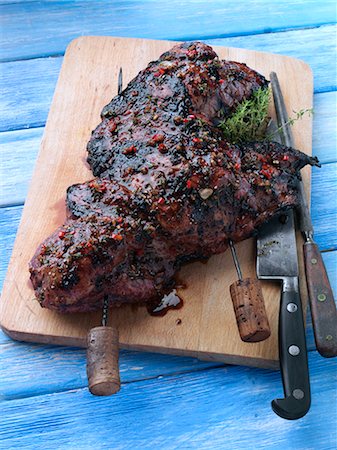 Butterflied leg of lamb marinaded and barbecued Stock Photo - Rights-Managed, Code: 824-07585816