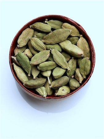 A bowl of green cardamoms on a white background Stock Photo - Rights-Managed, Code: 824-07585838