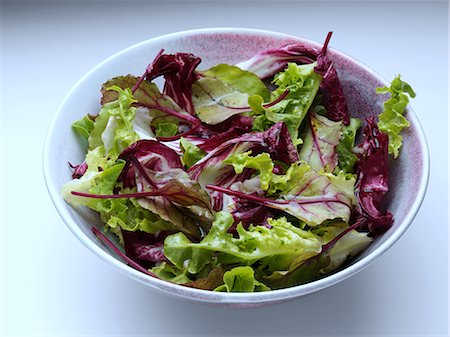 photograph of lettuce - A bowl of radicchio mixed leaf salad on a white background Stock Photo - Rights-Managed, Code: 824-07585831