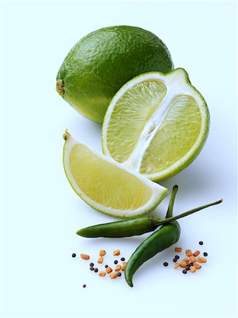 Limes and chillies on a white background Foto de stock - Con derechos protegidos, Código: 824-07585851