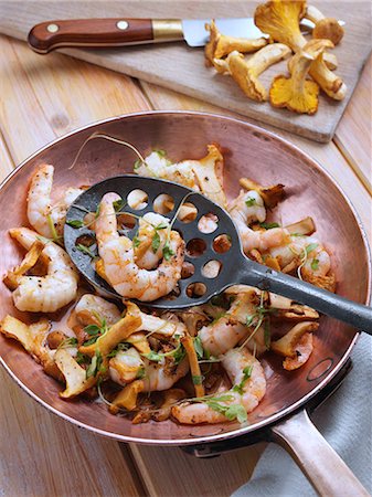 food being cooked - Prawns and girolle mushrooms Stock Photo - Rights-Managed, Code: 824-07586037