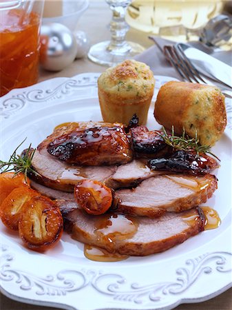 simsearch:824-07585950,k - Individual portion of leg of pork slices with kumquat marmalade glaze and cheese chive muffins main meals Stock Photo - Rights-Managed, Code: 824-07586183