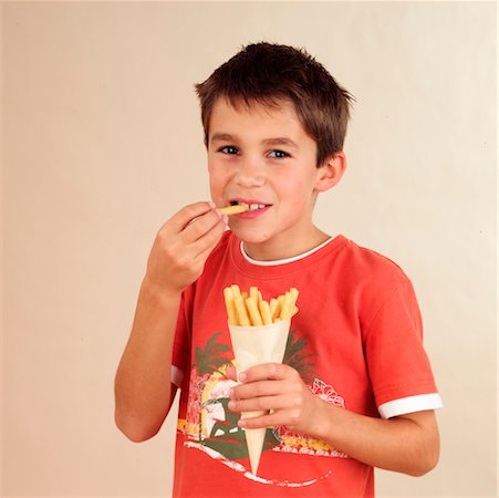simsearch:824-02888261,k - Child eating pastry sticks Stock Photo - Rights-Managed, Code: 824-02291811