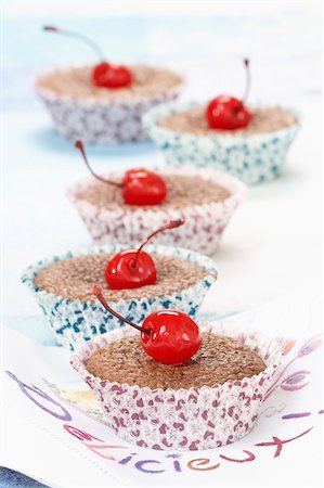 simsearch:825-05815265,k - Chocolate cup cakes topped with a crystallized cherry Stock Photo - Rights-Managed, Code: 825-05814736