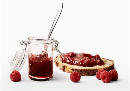 Raspberry jam on a slice of bread Stock Photo - Rights-Managed, Code: 825-05814918