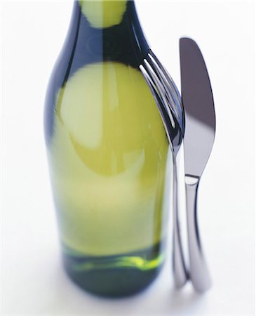 simsearch:825-06047983,k - Bottle of white wine with knife and fork Stock Photo - Rights-Managed, Code: 825-05815997