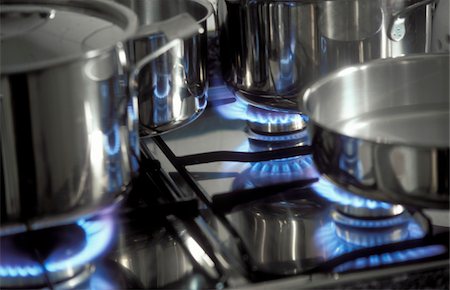 Gas stove with pans and blue flames Stock Photo - Rights-Managed, Code: 825-05811463