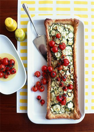 Courgette and cherry tomato thin pastry family tart Stock Photo - Rights-Managed, Code: 825-05812295