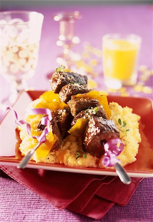 simsearch:825-06818108,k - Stag fillet brochettes with almond milk polenta and orange zests Foto de stock - Con derechos protegidos, Código: 825-05812723