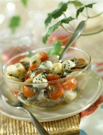 Orecchiettes,anchovy,cherry tomato, mozzarella and caper salad Stock Photo - Rights-Managed, Code: 825-05813597