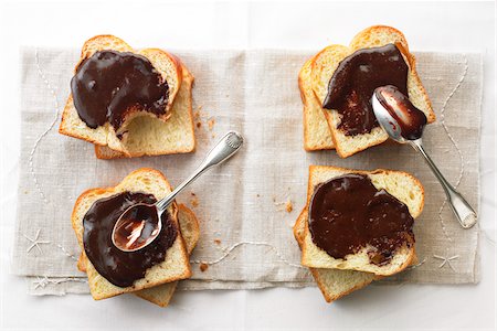 Gianduja spread on sliced bread Stock Photo - Rights-Managed, Code: 825-05835747