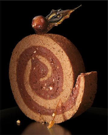 Slice of chocolate and hazelnut rolled cake Stock Photo - Rights-Managed, Code: 825-05836278