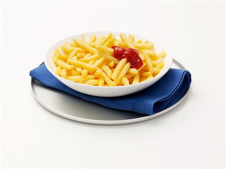 salsa de tomate - Plate of french fries with ketchup Foto de stock - Con derechos protegidos, Código: 825-05836613