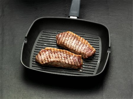 frying pan - Cooking steaks in a grill-pan Stock Photo - Rights-Managed, Code: 825-05836653