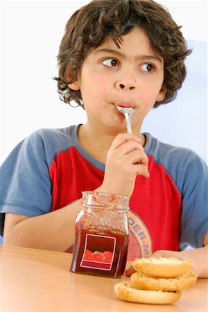 Boy eating jam Stock Photo - Rights-Managed, Code: 825-05837161