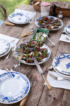 Grilled eggplants with tomato and basil,marinated harrings Foto de stock - Con derechos protegidos, Código: 825-05837179