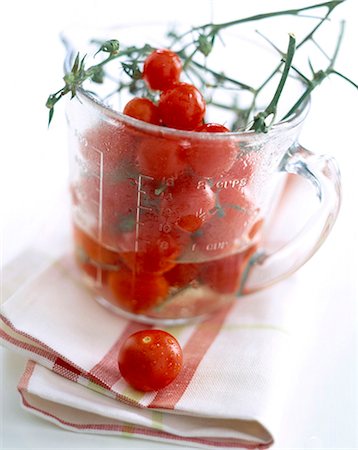 Measuring jug and cherry tomatoes Stock Photo - Rights-Managed, Code: 825-05986386