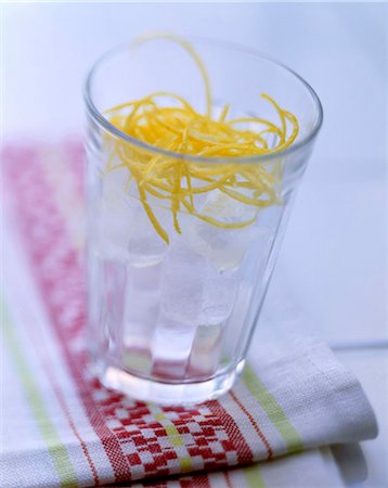 glass of water with ice cubes and lemon zest Stock Photo - Rights-Managed, Code: 825-05986382