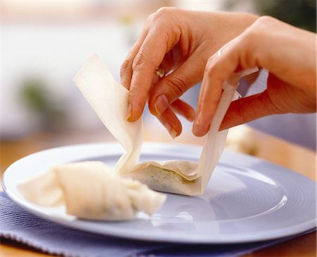 Folding the stuffed filo pastry Stock Photo - Rights-Managed, Code: 825-05987120