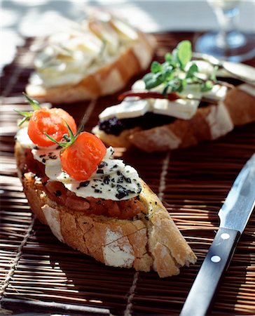 simsearch:652-05807417,k - Mozzarella, basil and preserved tomato open sandwich Stock Photo - Rights-Managed, Code: 825-05988481