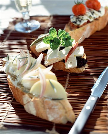 simsearch:825-05811280,k - Fresh goat's cheese, apple, shallot and rosemary open sandwich Stock Photo - Rights-Managed, Code: 825-05988483