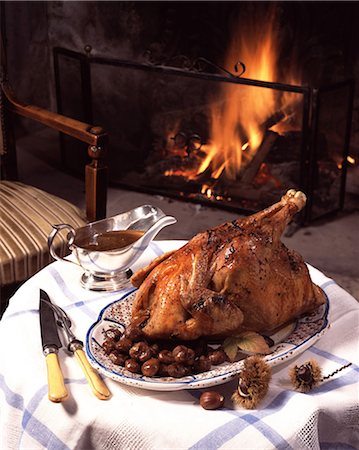 Capon with chestnuts, on table with fireplace Stock Photo - Rights-Managed, Code: 825-05988941