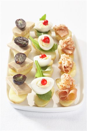 Tray of Touquet Ratte potato canapés Stock Photo - Rights-Managed, Code: 825-06045758