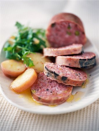 sliced mushroom - Pistachio and truffle saucisson,potato salad Foto de stock - Con derechos protegidos, Código: 825-06045906