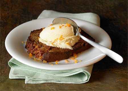 Slice of pan-fried gingerbread with vanilla ice cream and orange zests Stock Photo - Rights-Managed, Code: 825-06046029
